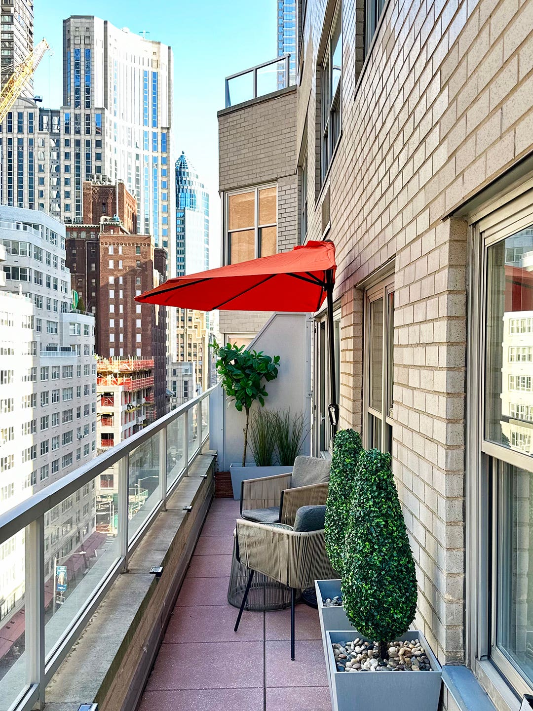 This $60 Half (!) Umbrella Makes Finding Shade in Your Itsy-Bitsy Outdoor Space So Easy