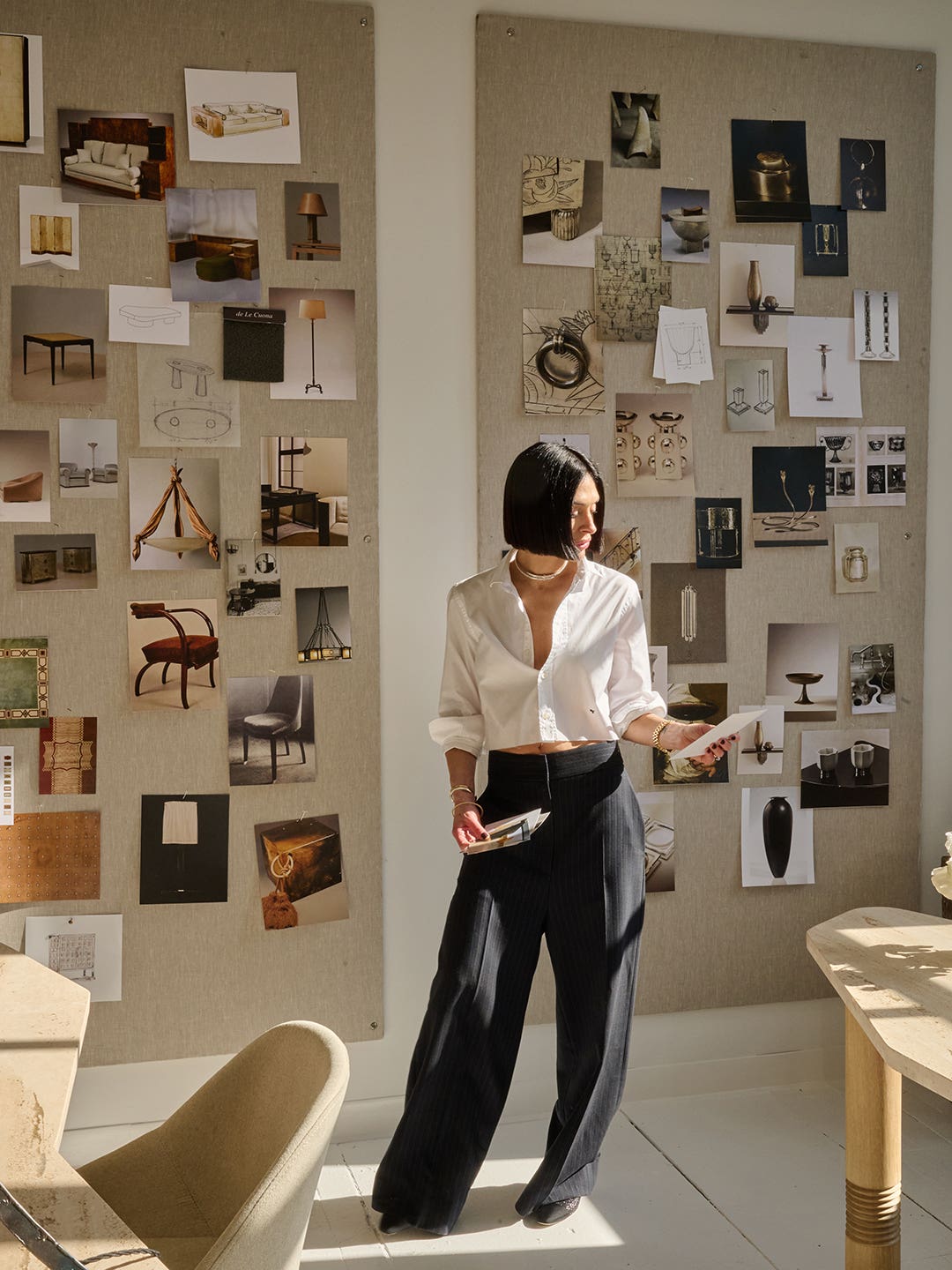 Athena Calderone in front of moodboards