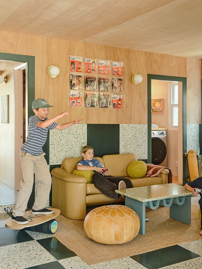 Kids playing video games in a family room