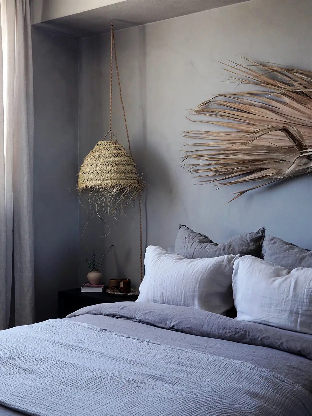 palm frond over bed