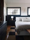 bedroom with black windows