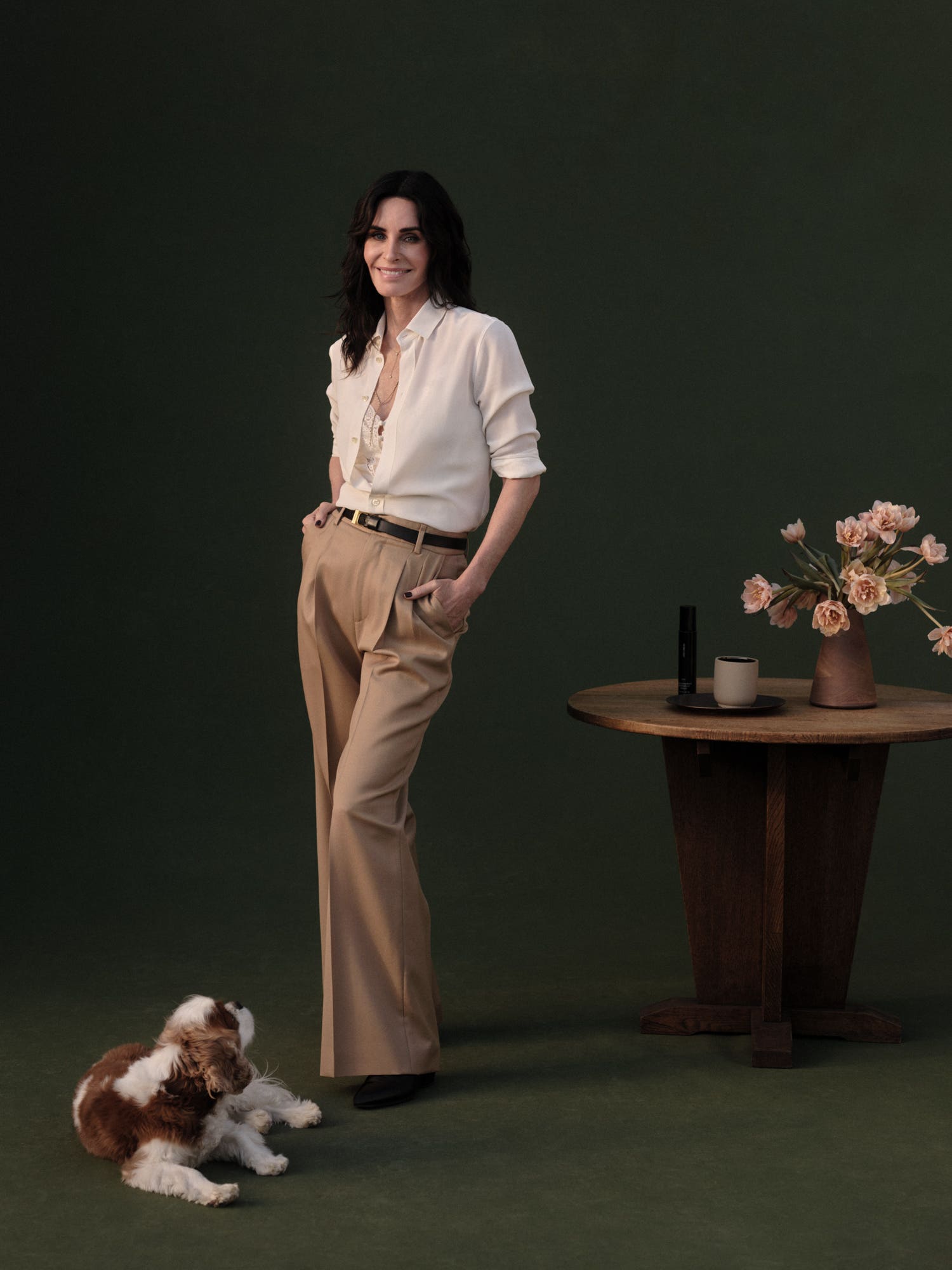 Woman in white shirt and tan pants