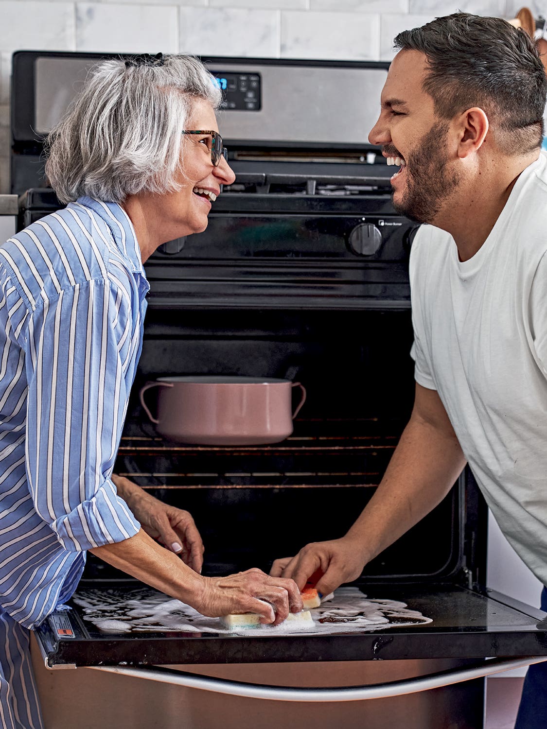 Dan Pelosi and his mom cleaning an oven
