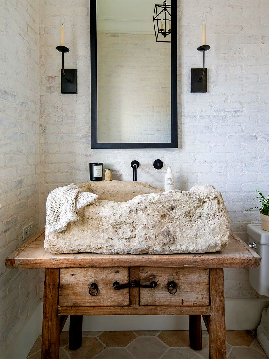 large white stone sink on wood table