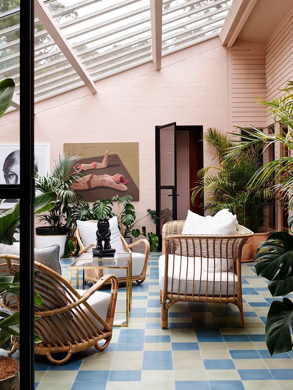 pink sunroom with slanted skylight