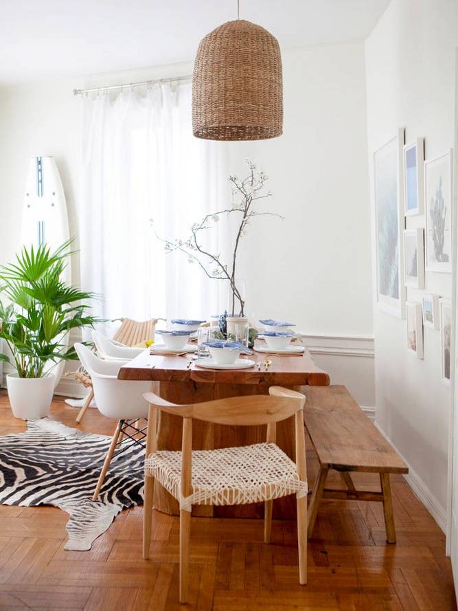 dining room makeover with wood dining table and rattan chandelier