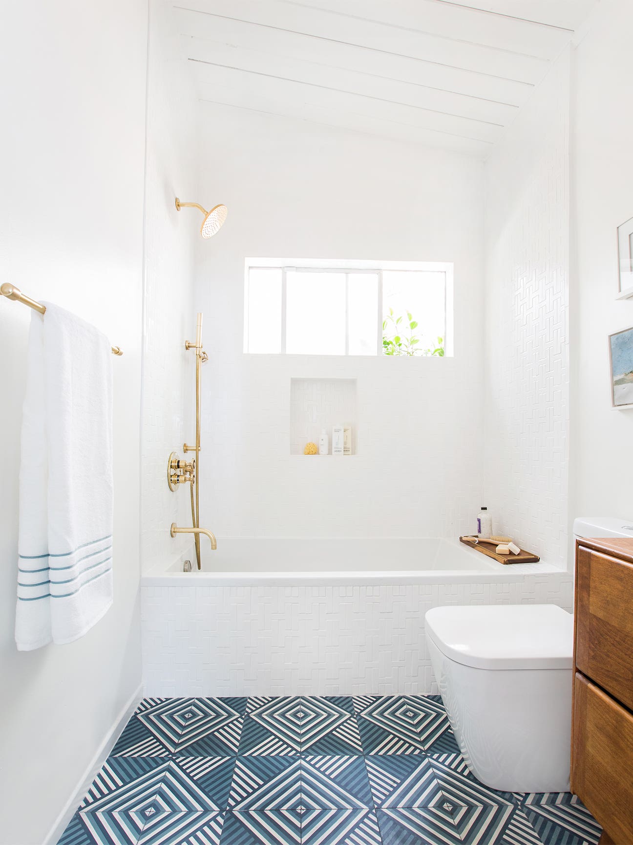 white bathroom with blue tile floors