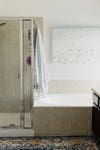 dated tub next to a shower