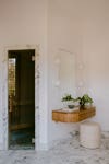 floating vanity next to sauna room