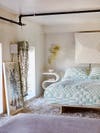 lofted bedroom with blue bedding