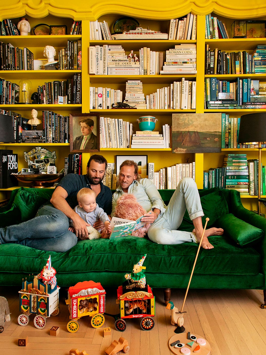 fathers and son on green velvet sofa