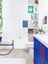 Bathroom with blue cabinets and white hardware