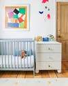 colorful nursery with blue ikea crib