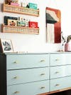 nursery with cane and wood IKEA wall shelves