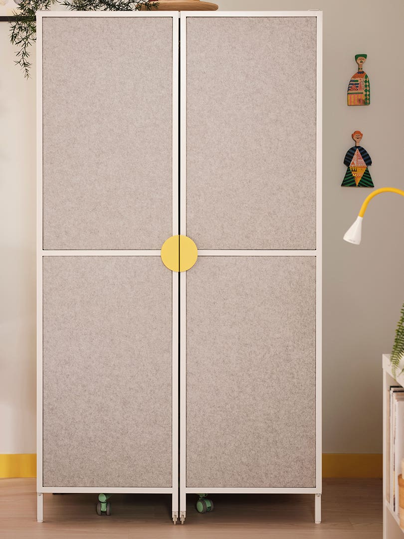 light gray cabinet from IKEA with yellow handles