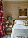 Bedroom with grasscloth wallpaper.