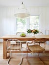 mix matched chairs around wood table