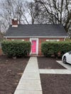 Front of house with sidewalk and dirt