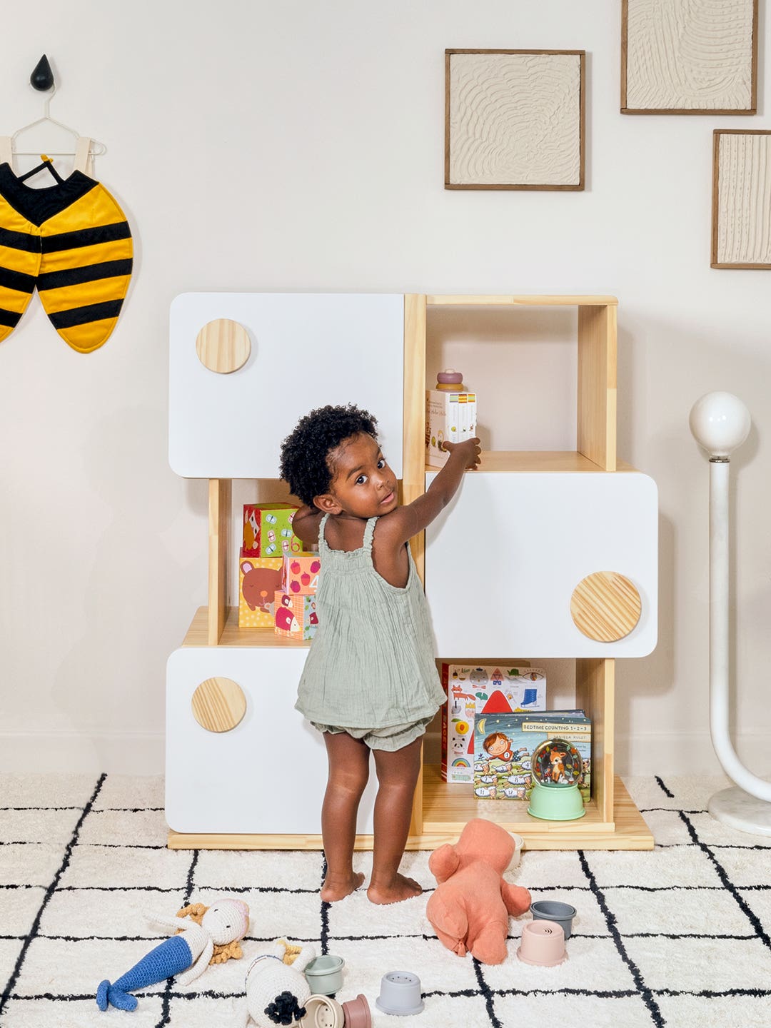 kid grabbing things off shelf