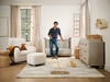 man leaning on crib