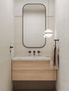 light wood vanity in powder bathroom