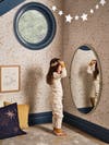 little girl playing dress up