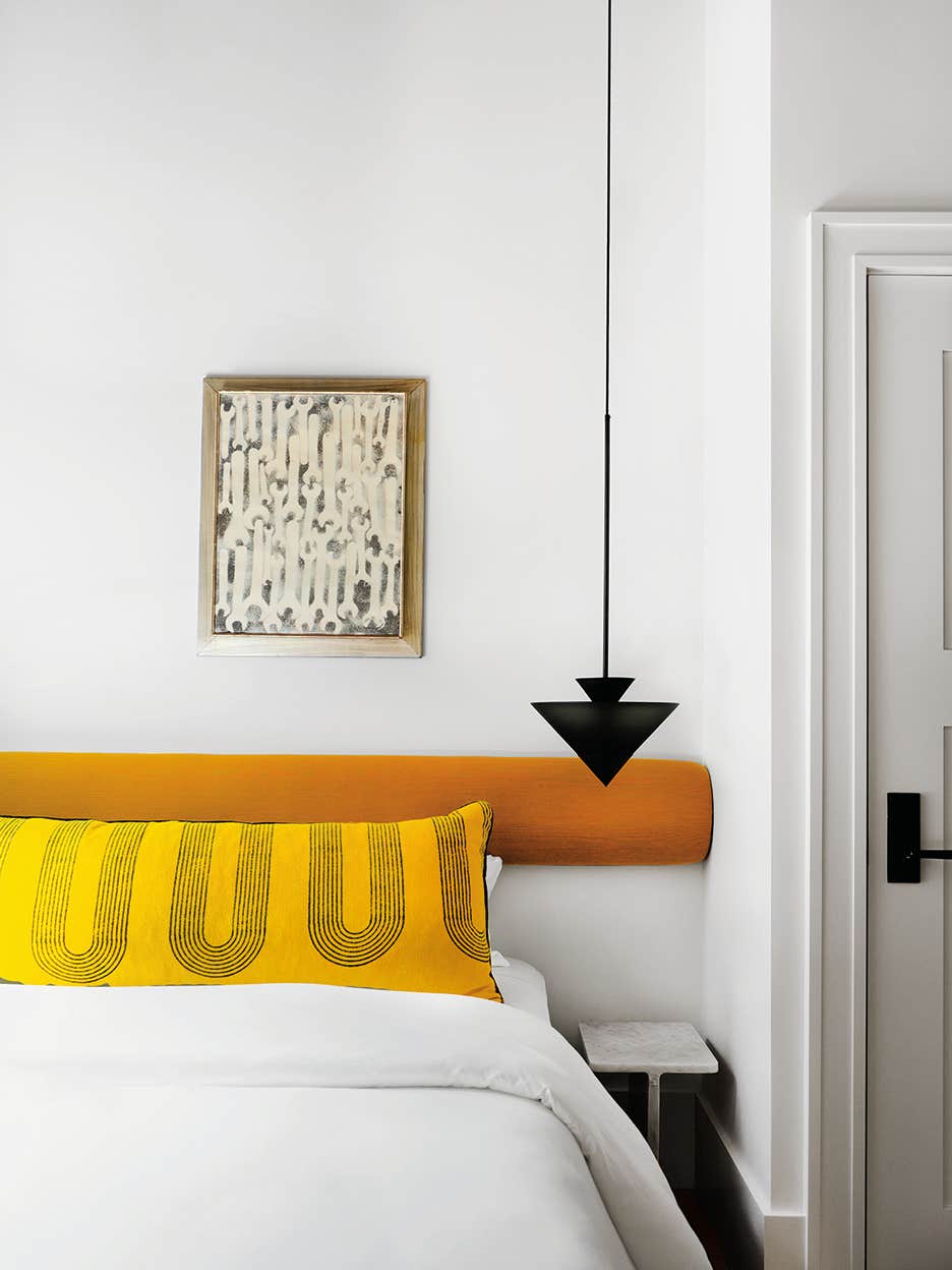 bed with yellow pillow