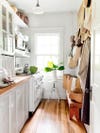 white galley kitchen with butcher block counters