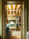 Green-painted and brown-striped little boy's room