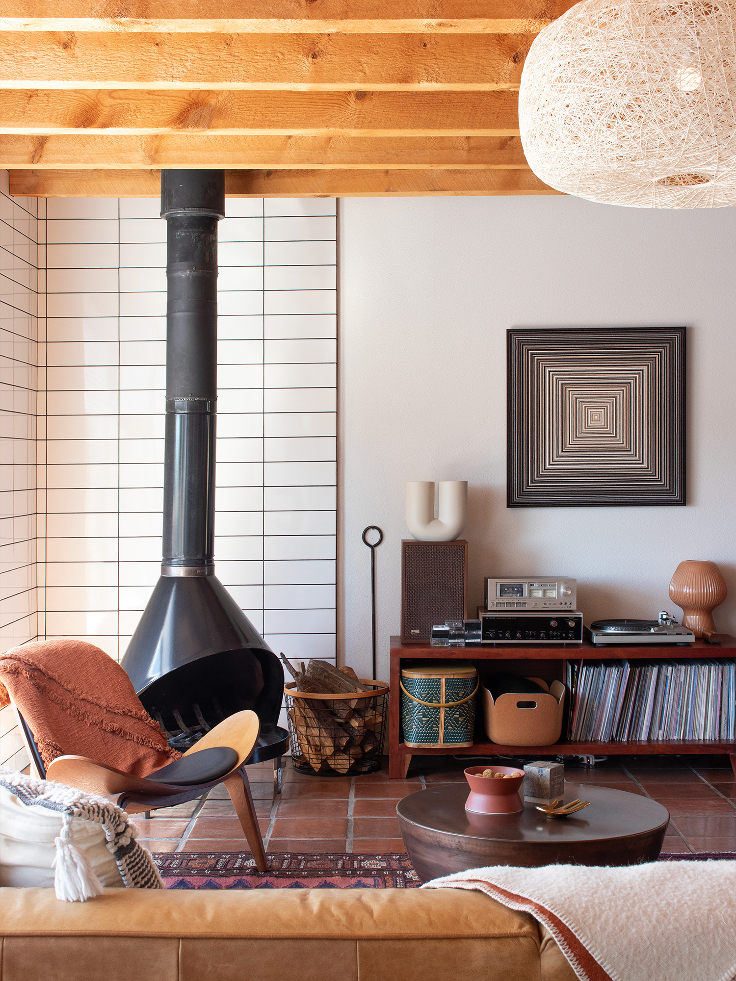 Mid-century living room with square felt art by Submaterial.