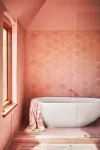 All-pink bathroom with white soaking tub on elevated floor. 