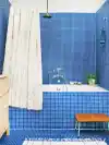 Bathroom covered in cobalt blue mosaic tile.